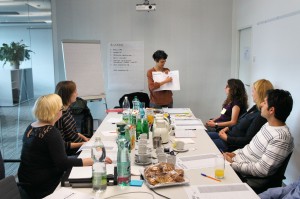 Vienna, Austria. The moderator describes how to execute an exercise during a participatory workshop.