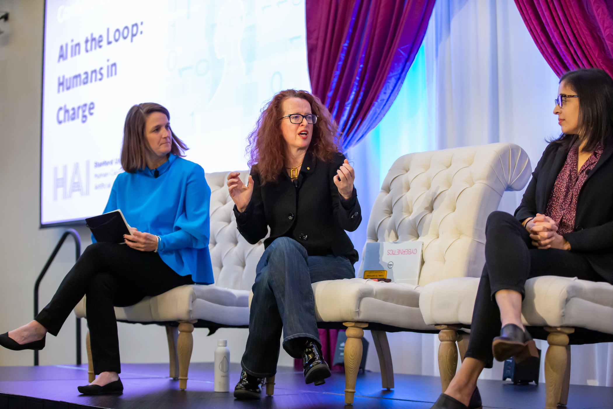 Stanford Institute for Human-Centered AI Fall Conference on November 15, 2022. Photography by: Christine Baker Genevieve Bell (center), with Elizabeth Gerber (left) and Saleema Amershi (right)